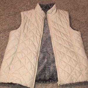 White fuzzy vest.